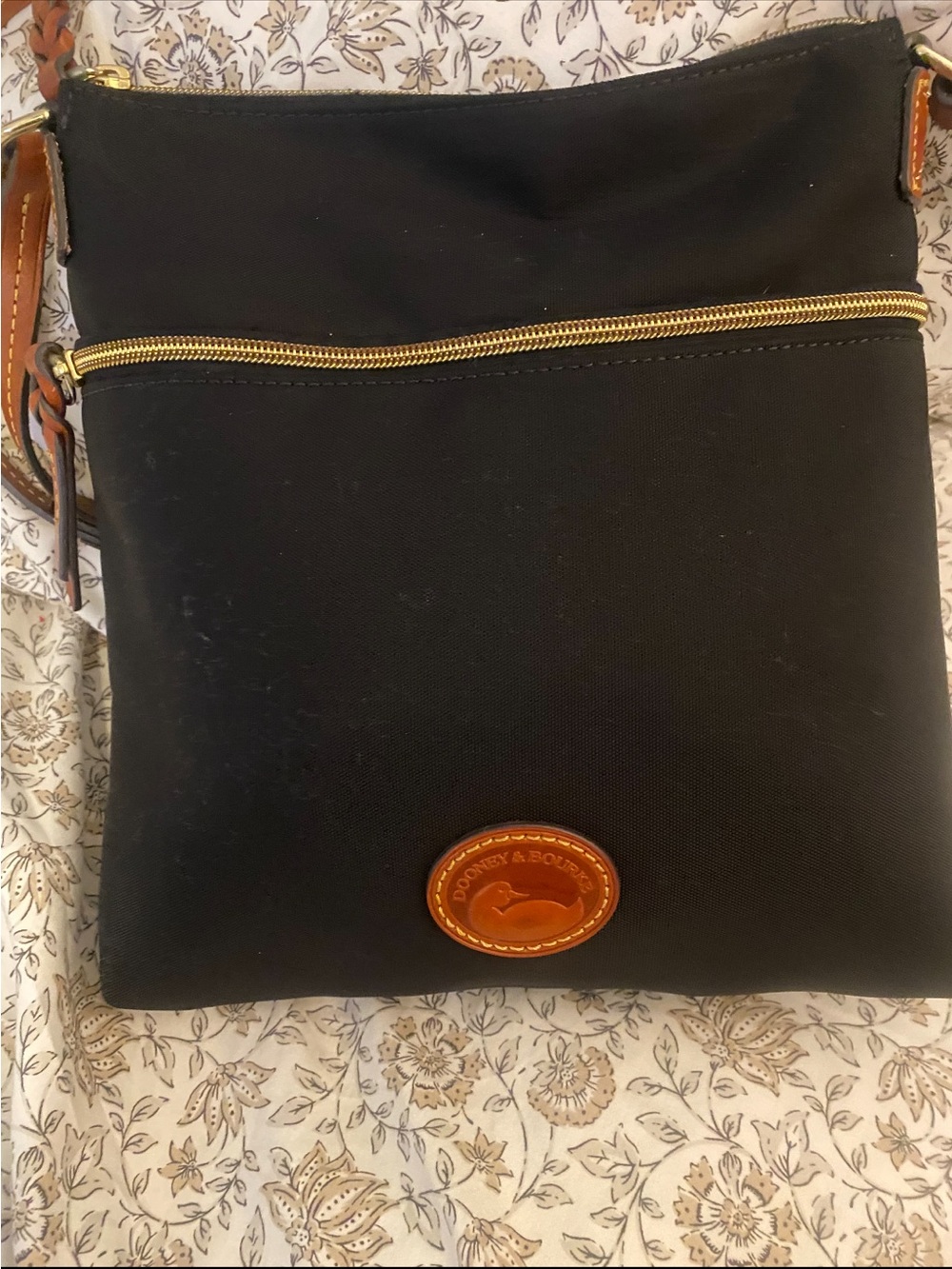 Like new Dooney & Bourke Black Crossbody with Tan Leather Trim and Gold Hardware